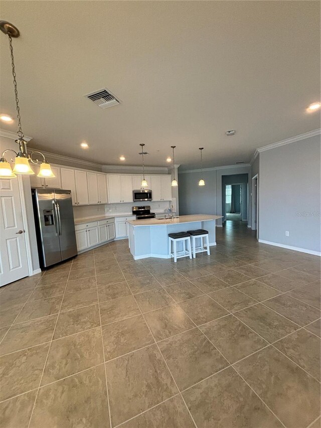 10054 Crooked Creek Dr Unit 201, Venice, FL 34293 - kitchen featuring appliances with stainless steel finishes, crown molding, tile patterned flooring, white cabinetry, and recessed lighting