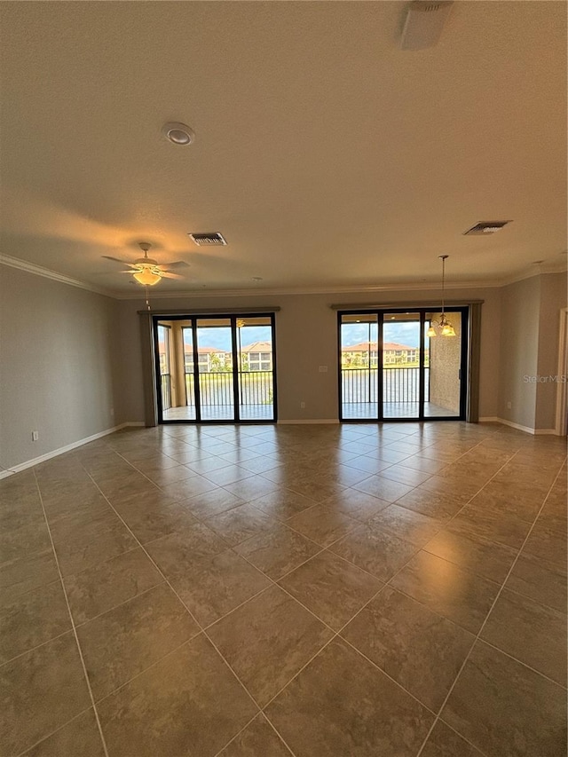 10054 Crooked Creek Dr Unit 201, Venice, FL 34293 - spare room featuring crown molding, dark tile patterned floors, a textured ceiling, and a ceiling fan
