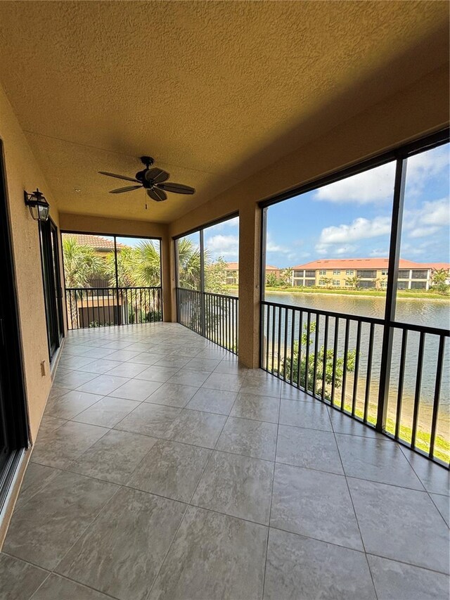 10054 Crooked Creek Dr Unit 201, Venice, FL 34293 - unfurnished sunroom featuring a water view