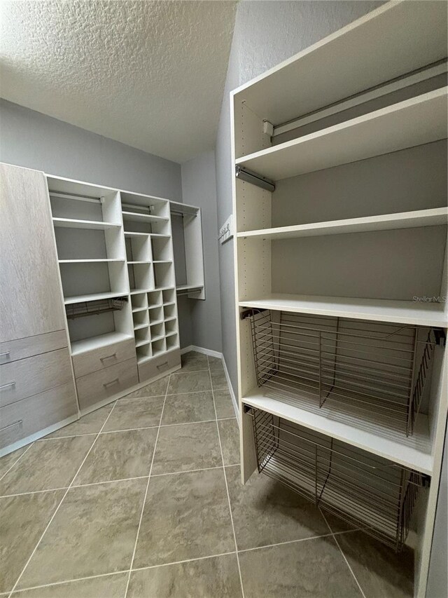 10054 Crooked Creek Dr Unit 201, Venice, FL 34293 - spacious closet with tile patterned flooring