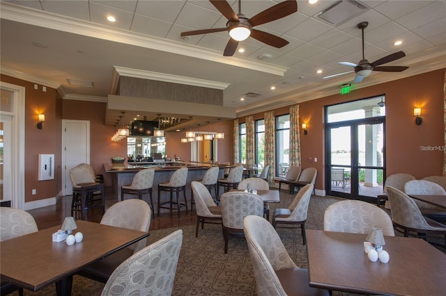 10054 Crooked Creek Dr Unit 201, Venice, FL 34293 - dining room featuring a ceiling fan and crown molding