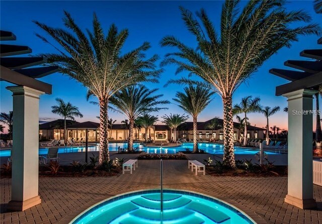 10054 Crooked Creek Dr Unit 201, Venice, FL 34293 - community pool featuring a patio