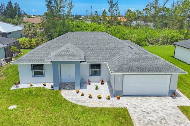 10443 Riverside Rd, Port Charlotte, FL 33981 - ranch-style house featuring a shingled roof, stucco siding, a garage, a front yard, and decorative driveway