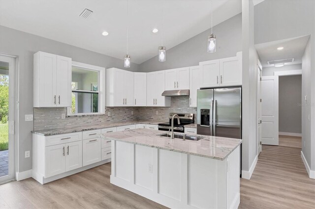 10443 Riverside Rd, Port Charlotte, FL 33981 - kitchen featuring stainless steel appliances, under cabinet range hood, decorative backsplash, white cabinetry, and recessed lighting
