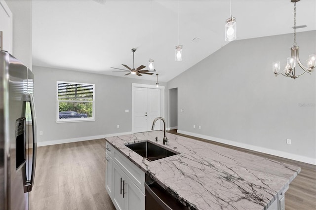 10443 Riverside Rd, Port Charlotte, FL 33981 - kitchen featuring stainless steel refrigerator with ice dispenser, ceiling fan, lofted ceiling, light wood-type flooring, and hanging light fixtures