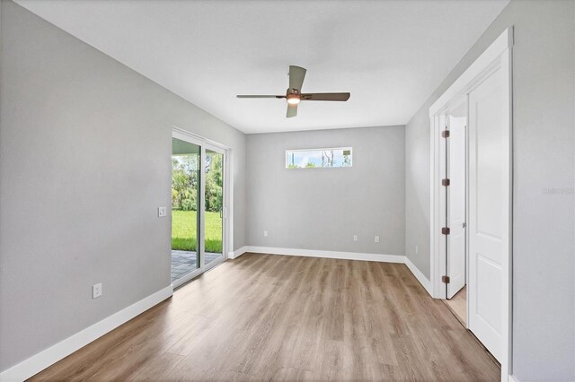 10443 Riverside Rd, Port Charlotte, FL 33981 - unfurnished room with light wood-style floors and a ceiling fan