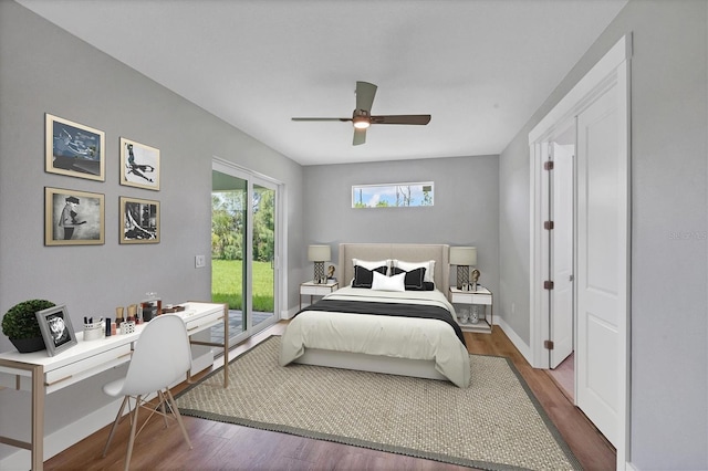 10443 Riverside Rd, Port Charlotte, FL 33981 - bedroom featuring access to exterior, a desk, wood finished floors, and a ceiling fan