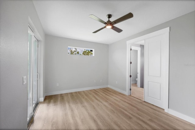 10443 Riverside Rd, Port Charlotte, FL 33981 - unfurnished bedroom with light wood-type flooring, a ceiling fan, and ensuite bathroom