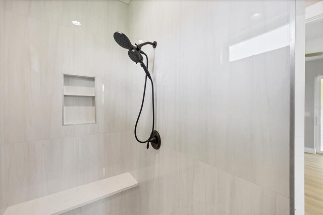 10443 Riverside Rd, Port Charlotte, FL 33981 - bathroom view of a tile shower and wood finished floors