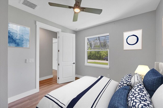 10443 Riverside Rd, Port Charlotte, FL 33981 - bedroom featuring light wood-style flooring and a ceiling fan