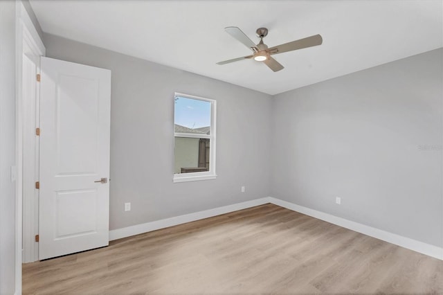 10443 Riverside Rd, Port Charlotte, FL 33981 - empty room featuring light wood-style flooring and a ceiling fan