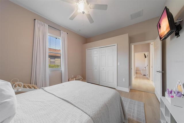 14901 17th Ave E, Bradenton, FL 34212 - bedroom with light wood-style floors, ceiling fan, and a closet