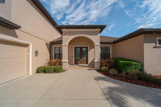 14901 17th Ave E, Bradenton, FL 34212 - view of exterior entry with french doors, stucco siding, and driveway