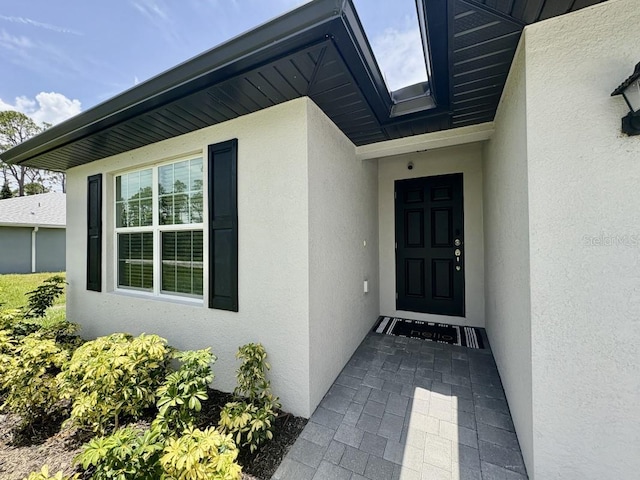 2425 Maclachlan St, Port Charlotte, FL 33953 - entrance to property featuring stucco siding