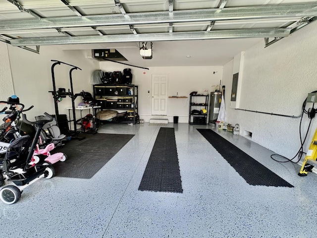 2425 Maclachlan St, Port Charlotte, FL 33953 - garage with a garage door opener, electric water heater, and a textured wall