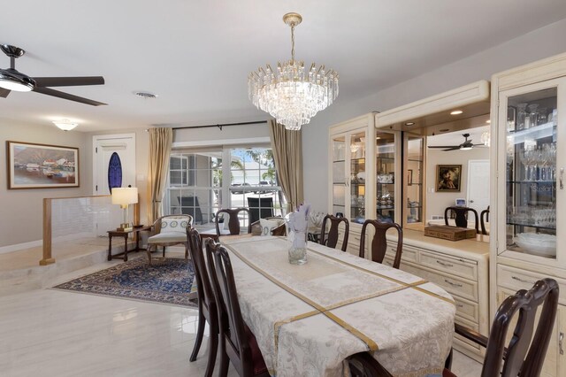 3715 101st St W, Bradenton, FL 34210 - dining room with a ceiling fan and a chandelier