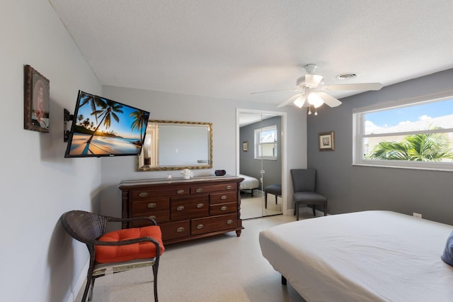 3715 101st St W, Bradenton, FL 34210 - bedroom featuring multiple windows, a ceiling fan, and a closet