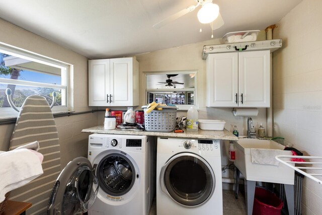 3715 101st St W, Bradenton, FL 34210 - washroom featuring washing machine and clothes dryer, ceiling fan, cabinet space, and concrete block wall