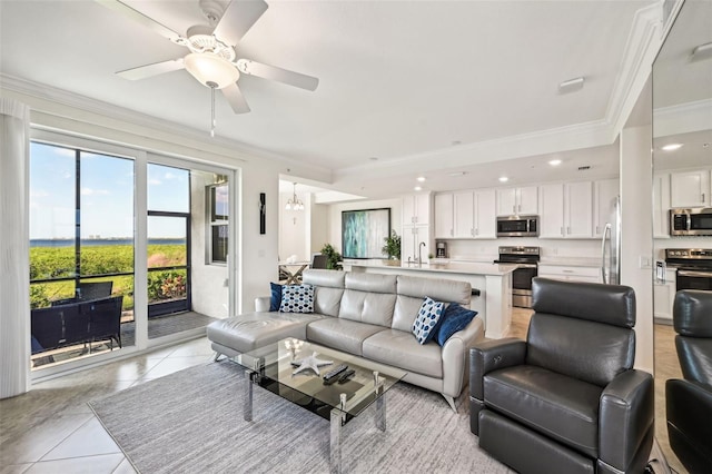 850 Tidewater Shores Loop Unit 102, Bradenton, FL 34208 - living area featuring ornamental molding, light tile patterned floors, ceiling fan, a chandelier, and recessed lighting