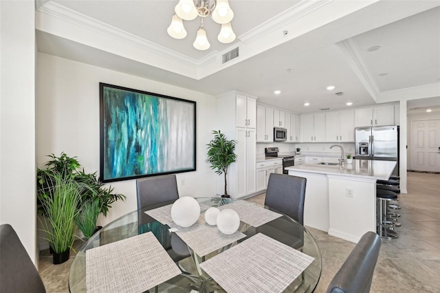 850 Tidewater Shores Loop Unit 102, Bradenton, FL 34208 - dining area featuring a chandelier, crown molding, a raised ceiling, and recessed lighting