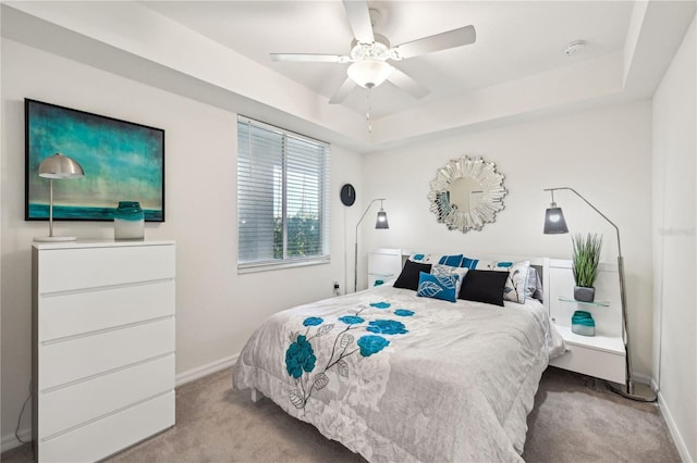850 Tidewater Shores Loop Unit 102, Bradenton, FL 34208 - carpeted bedroom featuring a raised ceiling and ceiling fan