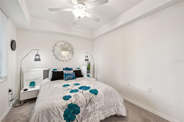 850 Tidewater Shores Loop Unit 102, Bradenton, FL 34208 - bedroom featuring carpet flooring, ceiling fan, and a tray ceiling