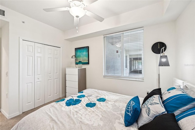 850 Tidewater Shores Loop Unit 102, Bradenton, FL 34208 - bedroom with a closet, carpet, and a ceiling fan
