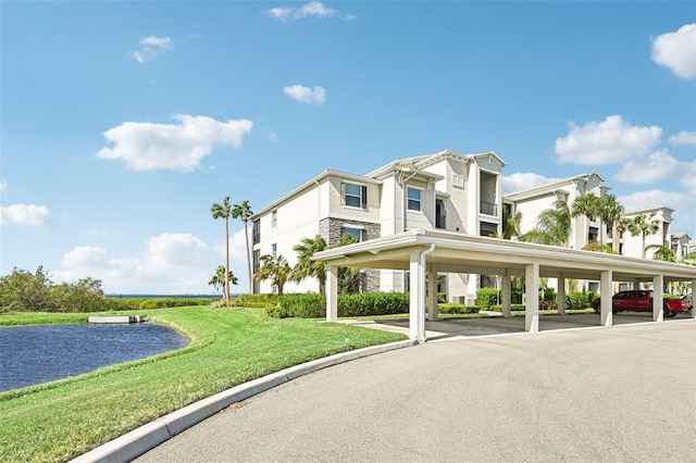 850 Tidewater Shores Loop Unit 102, Bradenton, FL 34208 - view of building exterior featuring covered parking