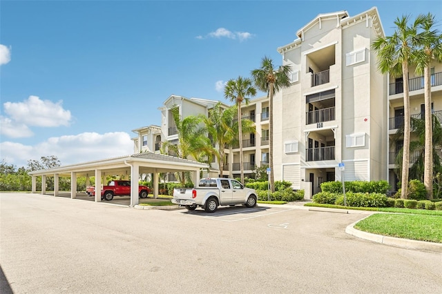 850 Tidewater Shores Loop Unit 102, Bradenton, FL 34208 - view of apartment building / complex with covered and uncovered parking