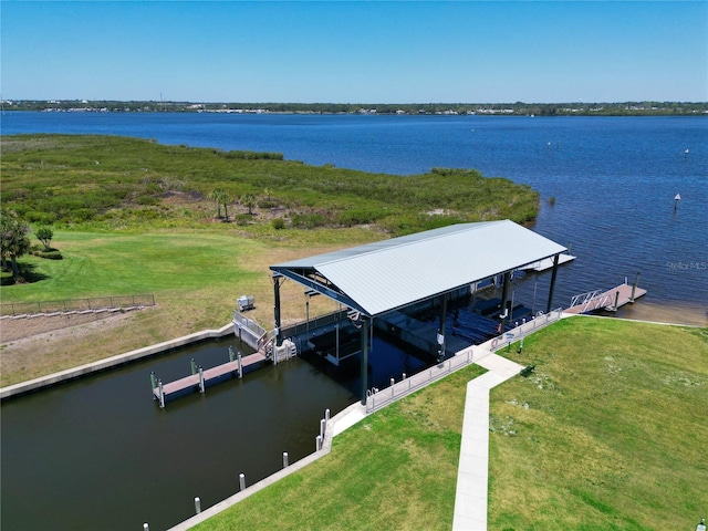 850 Tidewater Shores Loop Unit 102, Bradenton, FL 34208 - dock area featuring a water view, boat lift, and a lawn