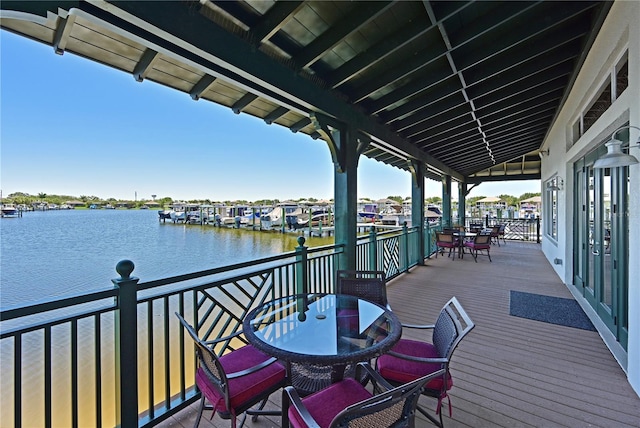 850 Tidewater Shores Loop Unit 102, Bradenton, FL 34208 - deck with a water view and outdoor dining space