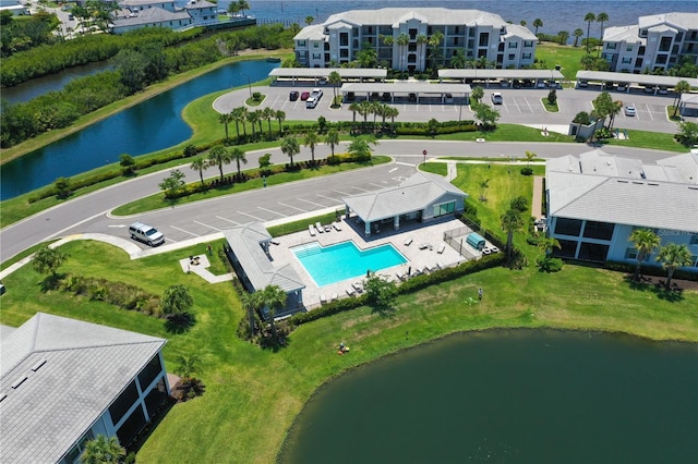 850 Tidewater Shores Loop Unit 102, Bradenton, FL 34208 - bird's eye view of a pool and a nearby body of water