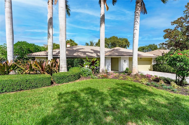4852 Peregrine Point Cir N, Sarasota, FL 34231 - ranch-style house featuring a tiled roof, an attached garage, a front yard, driveway, and stucco siding