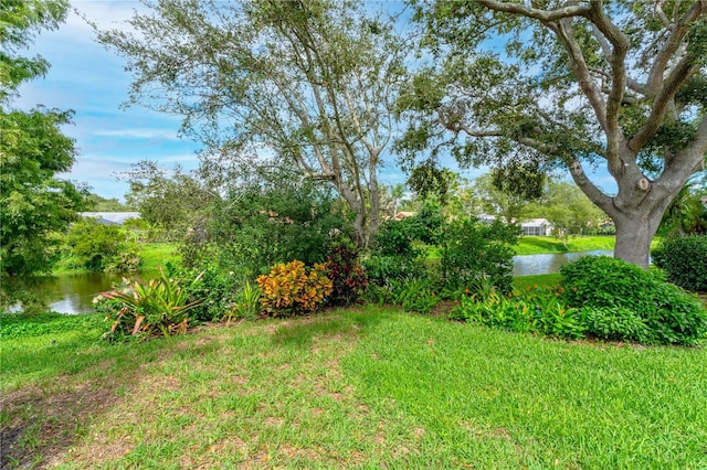 4852 Peregrine Point Cir N, Sarasota, FL 34231 - view of green lawn featuring a water view