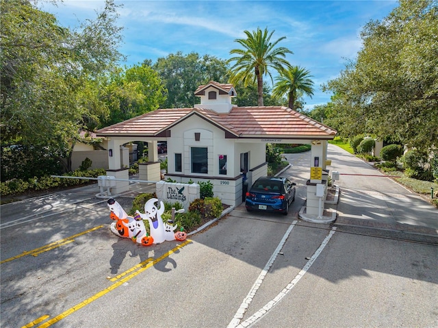 4852 Peregrine Point Cir N, Sarasota, FL 34231 - mediterranean / spanish house featuring a tiled roof and stucco siding