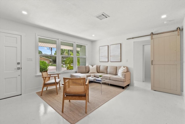 1051 Indian Beach Dr, Sarasota, FL 34234 - living room with a barn door, recessed lighting, and finished concrete floors