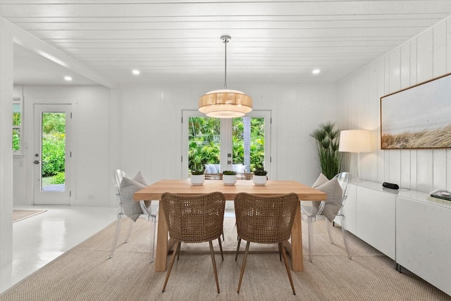 1051 Indian Beach Dr, Sarasota, FL 34234 - dining area with healthy amount of natural light, french doors, and recessed lighting