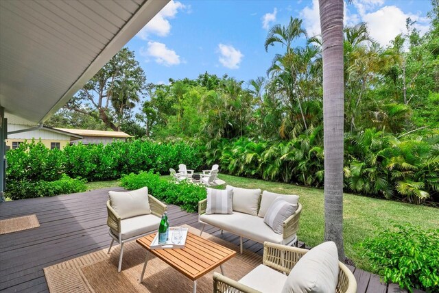 1051 Indian Beach Dr, Sarasota, FL 34234 - wooden deck featuring outdoor lounge area and a yard
