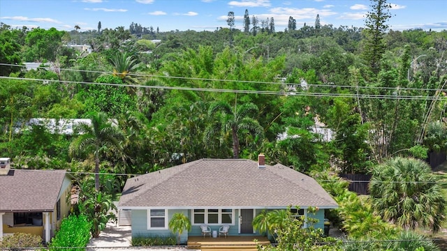1051 Indian Beach Dr, Sarasota, FL 34234 - aerial view of property and surrounding area featuring a heavily wooded area