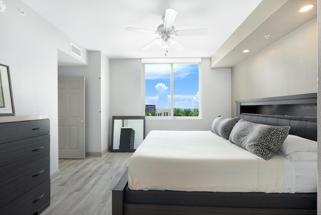 800 N Tamiami Trl Unit 405, Sarasota, FL 34236 - bedroom featuring light wood-style floors, recessed lighting, and a ceiling fan
