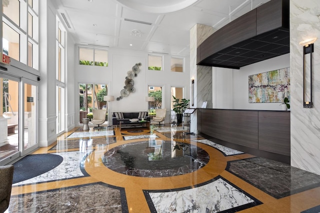 800 N Tamiami Trl Unit 405, Sarasota, FL 34236 - community lobby featuring a high ceiling, coffered ceiling, and recessed lighting