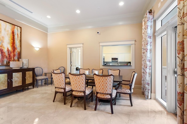 800 N Tamiami Trl Unit 405, Sarasota, FL 34236 - dining space featuring crown molding, light marble finish flooring, and recessed lighting
