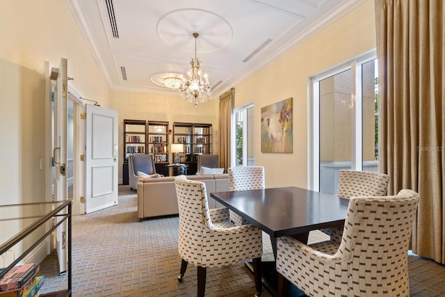 800 N Tamiami Trl Unit 405, Sarasota, FL 34236 - carpeted dining room featuring a chandelier and crown molding