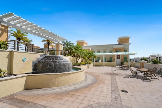800 N Tamiami Trl Unit 405, Sarasota, FL 34236 - view of home's community featuring a pergola and a patio area