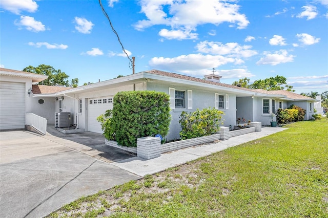 6103 6th Ave NW, Bradenton, FL 34209 - view of front of property with a garage, stucco siding, a front lawn, and concrete driveway