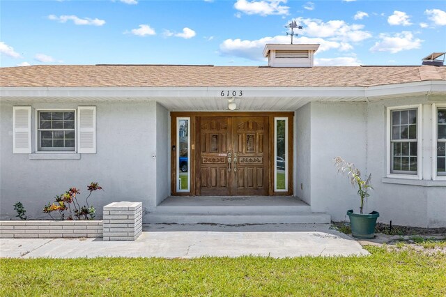6103 6th Ave NW, Bradenton, FL 34209 - entrance to property featuring stucco siding and a shingled roof