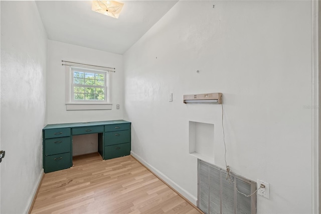 6103 6th Ave NW, Bradenton, FL 34209 - laundry room with light wood-type flooring and an office area