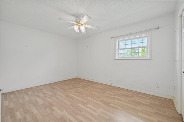 6103 6th Ave NW, Bradenton, FL 34209 - unfurnished room with light wood-type flooring, a ceiling fan, and a textured ceiling