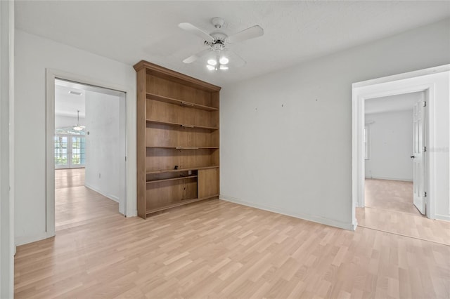 6103 6th Ave NW, Bradenton, FL 34209 - empty room with a ceiling fan and light wood-style floors