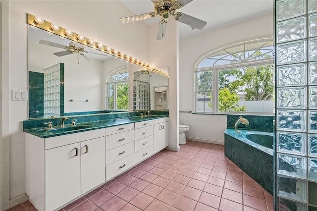 6103 6th Ave NW, Bradenton, FL 34209 - full bath with ceiling fan, double vanity, a garden tub, and tile patterned flooring